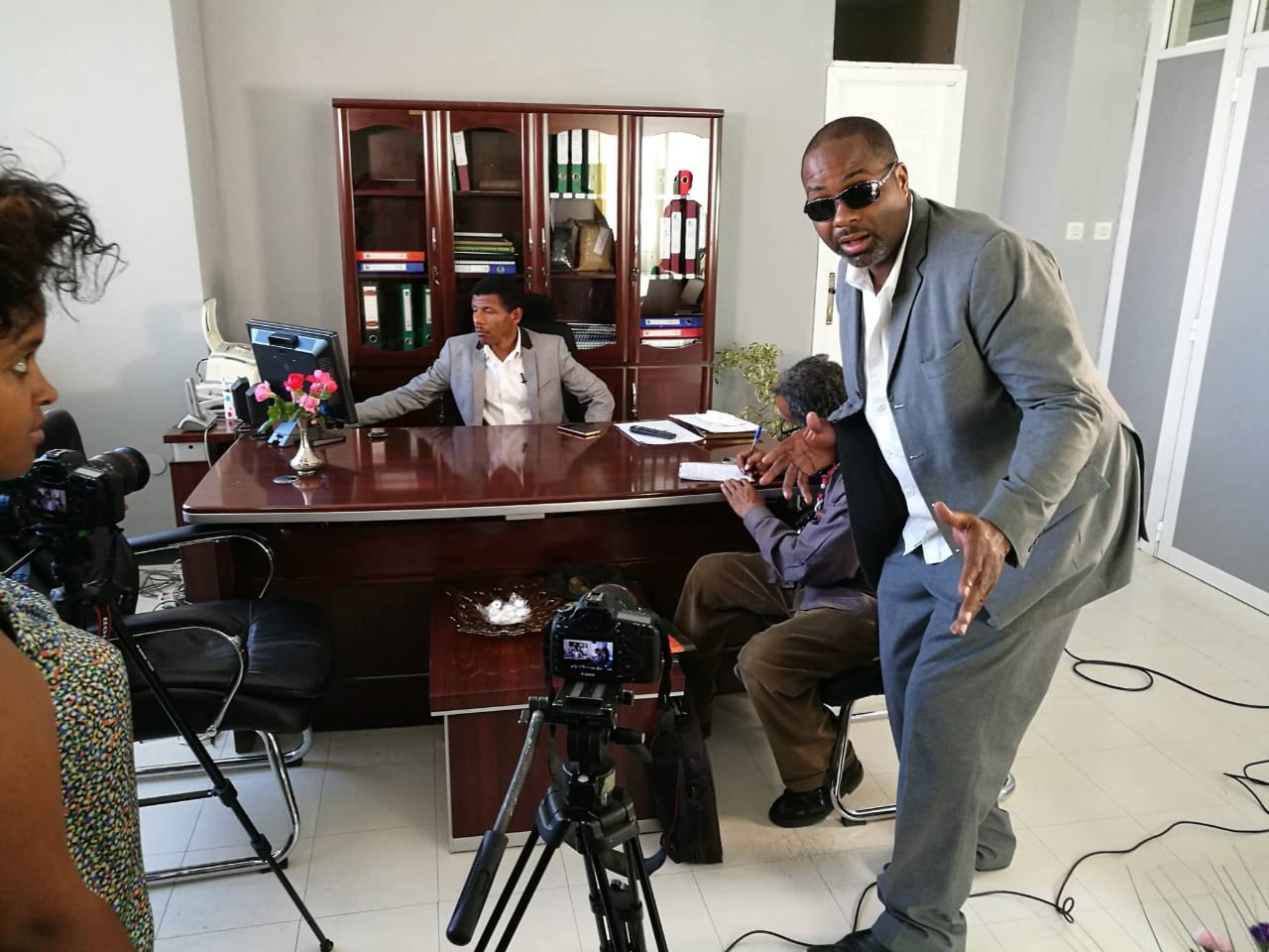 Coach Carlos coordinating an office interview production