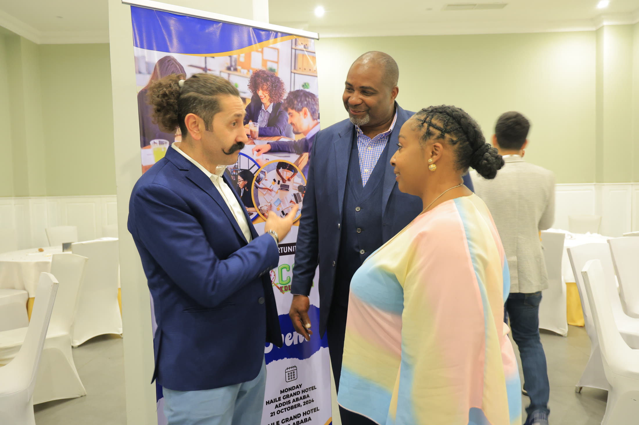 Coach Carlos in conversation with guests during a Tripolla event